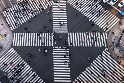 High angle view of people crossing road