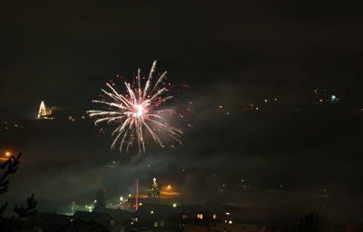 Firework display at night