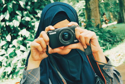 Midsection of man photographing