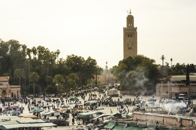View of koutoubia mosque and jamaa el fna square crowded - marrakech, morocco