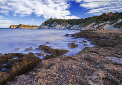 Long exposure shot to smooth out the sea, cala blanca, javea, alicante, spain.