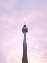 Low angle view of communications tower against sky