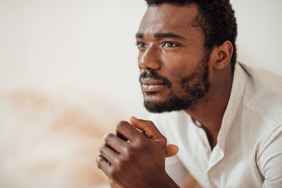 Portrait of young man looking away