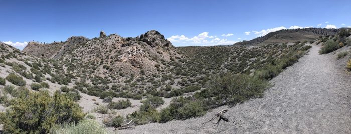 Scenic view of mountains against clear blue sky