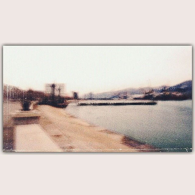 transfer print, water, clear sky, auto post production filter, built structure, building exterior, architecture, copy space, river, reflection, sky, lake, waterfront, nature, day, outdoors, no people, house, tree, city