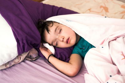 Cute baby sleeping on bed