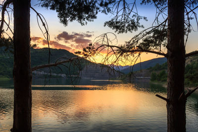 Scenic view of lake against sky during sunset