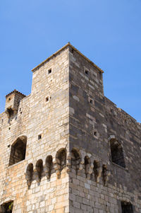 Low angle view of fort against blue sky