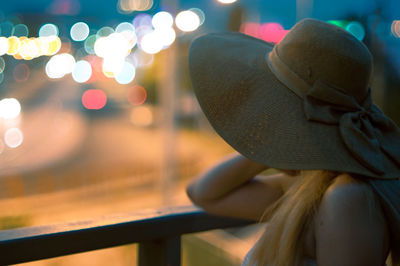 Close-up of hat on railing