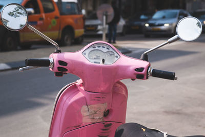 Close-up of motorcycle on street