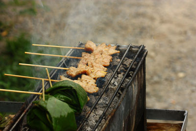 High angle view of meat on barbecue grill