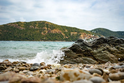 Scenic view of sea against cloudy sky