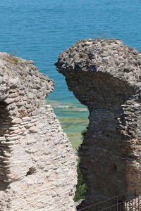 High angle view of rocks on sea shore