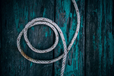 High angle view of rope on boardwalk