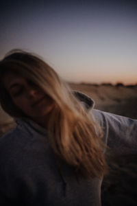 Portrait of woman against sky