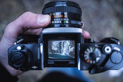 Close-up of hand holding camera