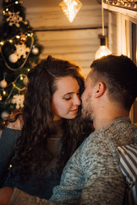 Young couple sitting outdoors