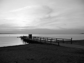 Pier over sea against sky