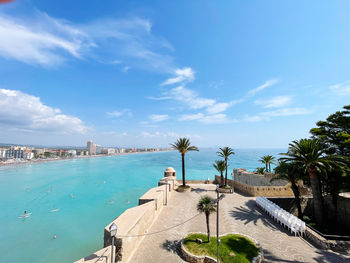 Scenic view of swimming pool by sea against sky