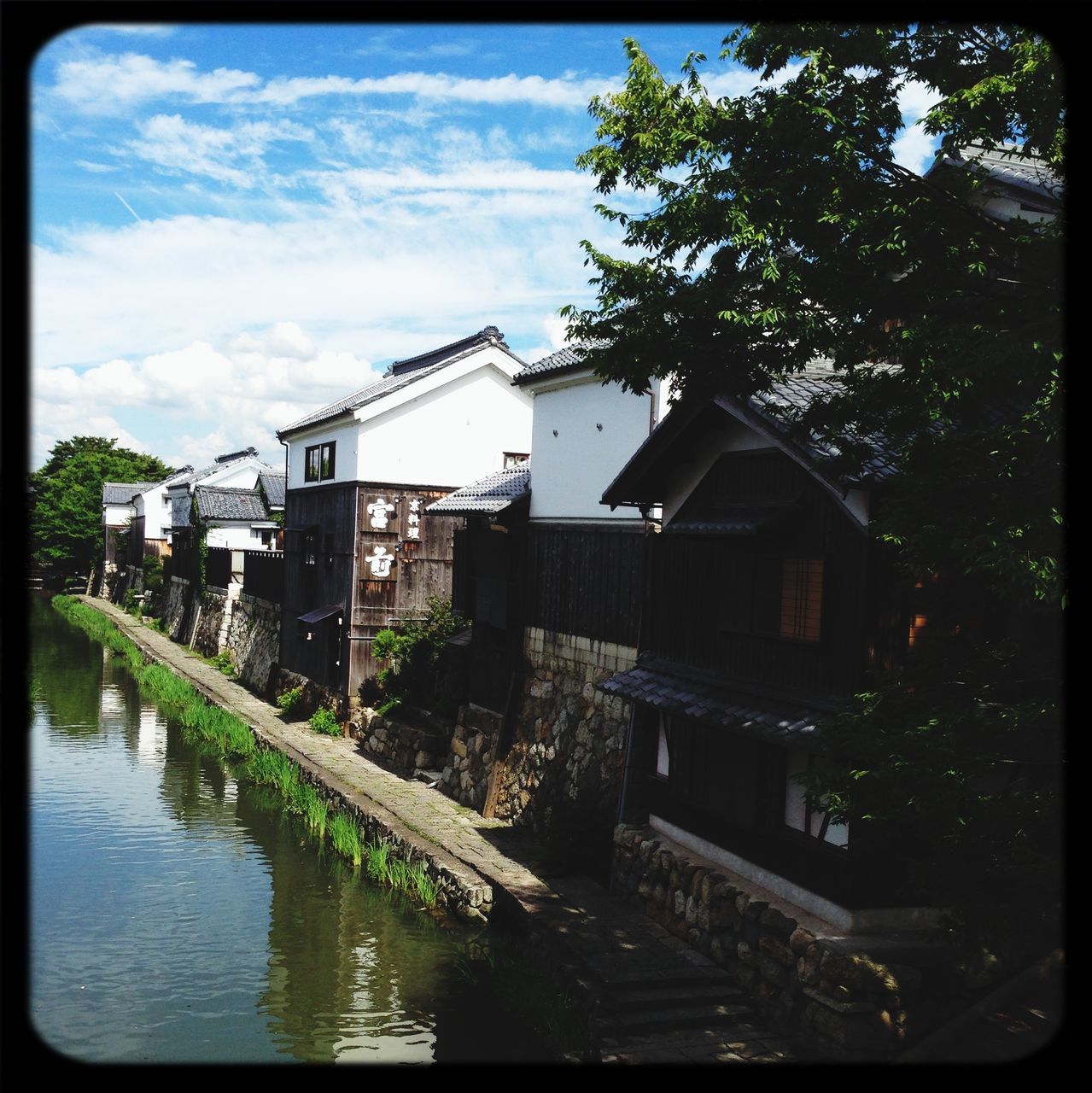 architecture, building exterior, built structure, transfer print, sky, tree, water, auto post production filter, cloud - sky, cloud, house, residential structure, day, waterfront, outdoors, residential building, river, growth, no people, nature