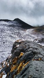 Lava on mountain against sky