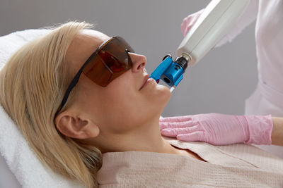 Close-up of young woman wearing sunglasses