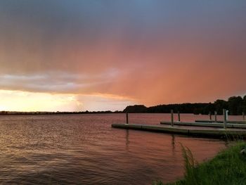 Scenic view of calm lake at sunset