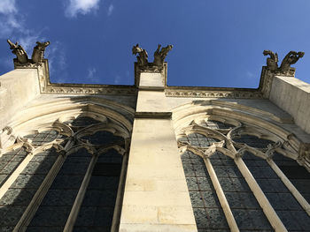 Low angle view of statue against blue sky