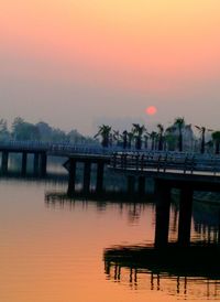 Bridge over river at dusk