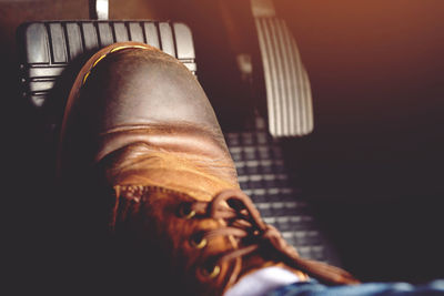 Man stepping on car brake to slow down, stop the car both normal  