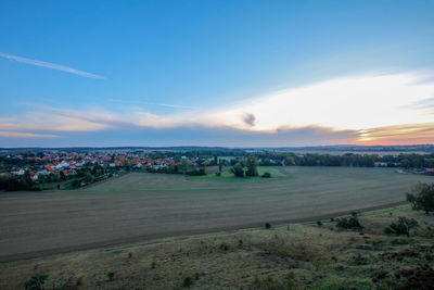 Scenic view of landscape against blue sky