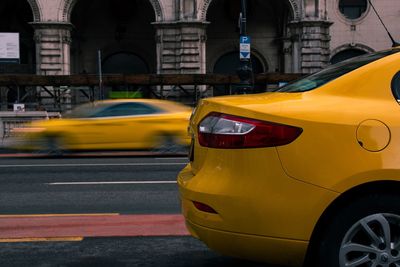 Yellow taxi on street in city