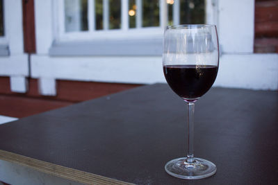 Close-up of wineglass on table