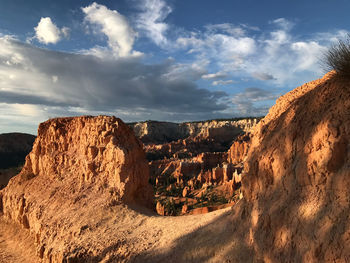 Panoramic view of rock formations against sky