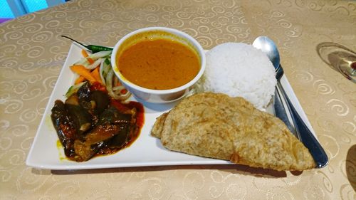 Close-up of breakfast served on table