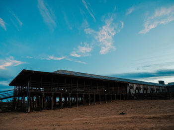 Built structure on beach against sky