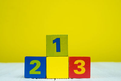 Close-up of toy over yellow background