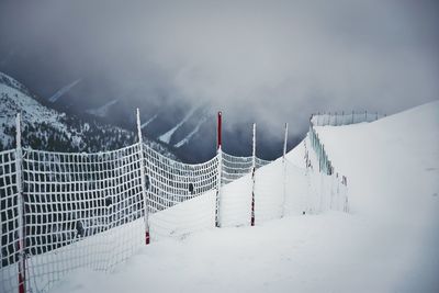 Panoramic view of snow covered mountain against sky