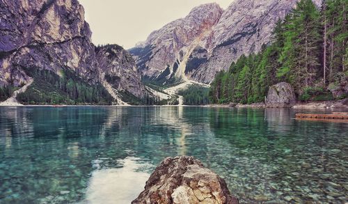 Scenic view of lake and mountains against sky