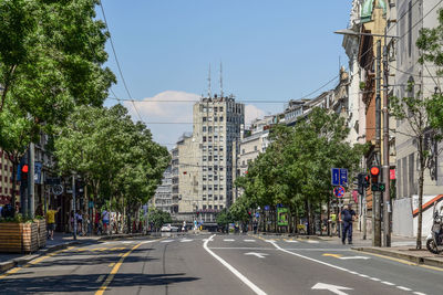 Road by buildings against sky in city, terazije square, belgrade, albania palace