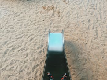 Lounge chairs on sand at beach