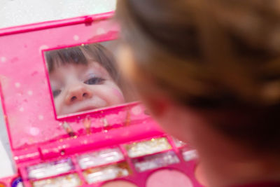 Portrait of cute girl with pink face