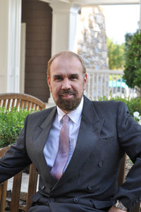 Portrait of a man sitting outdoors