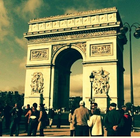 men, person, large group of people, architecture, tourist, lifestyles, famous place, built structure, tourism, travel destinations, arch, leisure activity, text, travel, entrance, sky, history, international landmark, architectural column