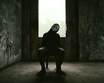 Woman standing in corridor