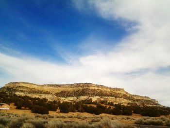 Scenic view of landscape against cloudy sky