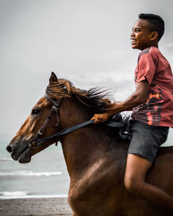 Man riding horse with happiness 