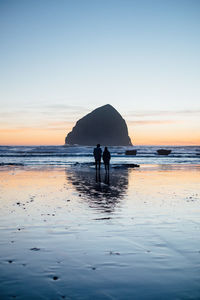 Scenic view of sea at sunset