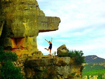 Low angle view of rocks against sky