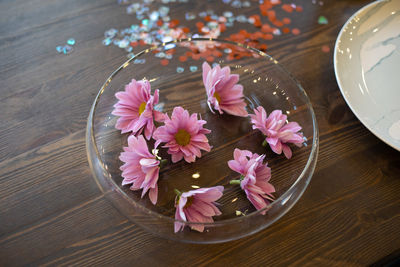 High angle view of pink flowers on table